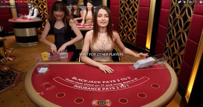live dealer blackjack screenshot with dealer at a table